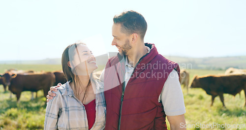 Image of Cow, love and happy couple on a cattle farm hugging, bonding and enjoy quality time outdoors in nature. Smile, portrait and woman farming cows and harvesting animal livestock with a farmer on field