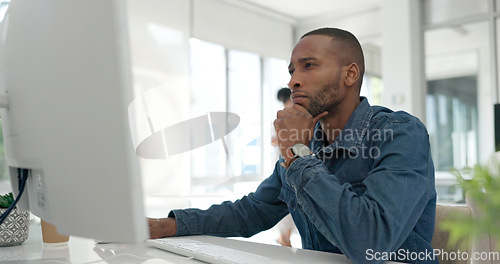 Image of Office computer, thinking and black man reading feedback review of social network, customer experience or ecommerce. Website analytics, research report and media employee doing online survey analysis