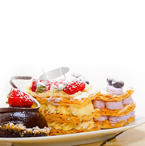 Image of selection of fresh cream cake dessert plate