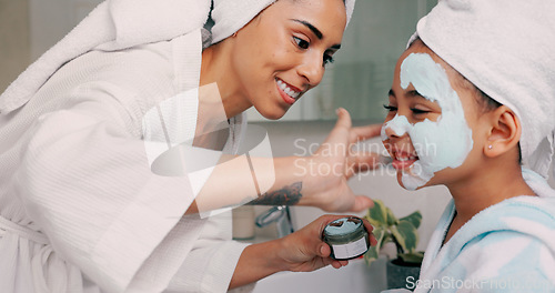 Image of Mom, daughter and home skincare face mask of family bonding together with a house spa day. Mama and girl with beauty treatment, facial serum and skin moisterizer cream looking happy with a smile