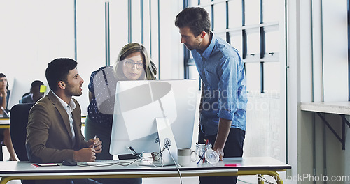 Image of Collaboration, management and team working together on a web design at a startup company office using internet. Group, teamwork and business people using computer for developers of idea