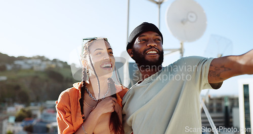 Image of Couple, bonding or talking on city rooftop and pointing, sightseeing Portugal or enjoying summer holiday vacation view. Smile, happy and love black man and interracial fashion woman on location date