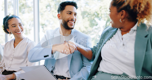 Image of Recruitment, handshake and business people networking in job interview waiting room, happy and friendly. We are hiring, job opportunity and hand shaking by man and woman relaxing in line at startup