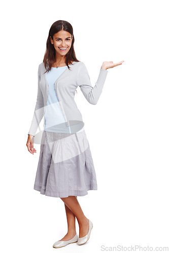 Image of Happy, casual and woman with product mockup in a studio for placement, marketing or advertising. Fashion, portrait and female model weighing mock up space with her hand isolated by a white background