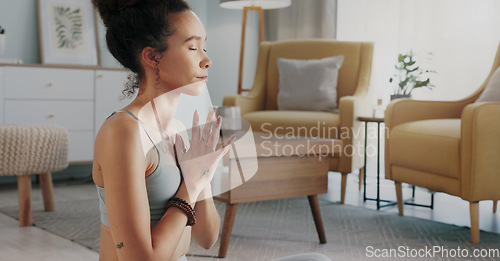 Image of Meditation, pilates and home yoga for black woman working on spiritual chakra peace, freedom of the mind and zen mindset. Body health, wellness lifestyle and relax girl training on living room floor