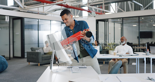 Image of Anger, frustrated and fire extinguisher with a business man breaking a computer during a breakdown at work. Compliance, glitch and 404 with an angry male employee smashing a desktop in the office