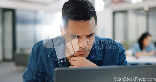 Image of Thinking, confused and man at laptop writing notes for project planning at web design company. Professional ux employee at office working, thoughtful and focused on email idea for client.