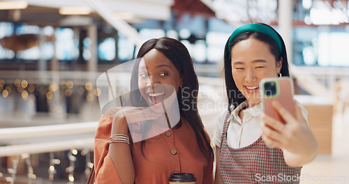 Image of Phone selfie, women and friends with peace sign at mall taking pictures for social media. Bokeh, hand gesture and girls taking photo on mobile smartphone for profile picture or happy memory together.