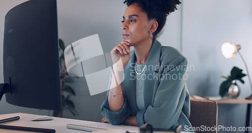 Image of Computer, thinking and black woman typing in office writing email at night. Working late, planning and female worker with solution working on sales, advertising or marketing ideas, report or proposal