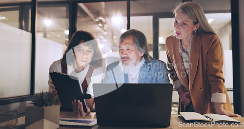Image of Laptop, tablet and business people teamwork on night project, digital finance portfolio or feedback review of stock market research. Financial economy, investment collaboration and trader trading nft
