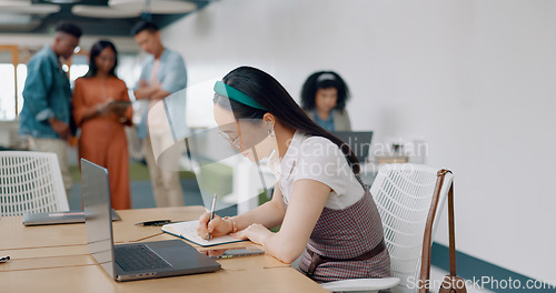 Image of Asian woman, laptop and writing in notebook for planning strategy, schedule management or finance checklist in office. Employee, reading email communication and notes for creative startup company