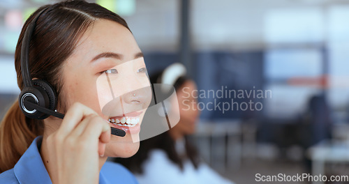 Image of Call center, customer support and sales with an asian woman consultant working on a headset in her office. Contact us, ecommerce and retail with a female employee consulting on a call at work