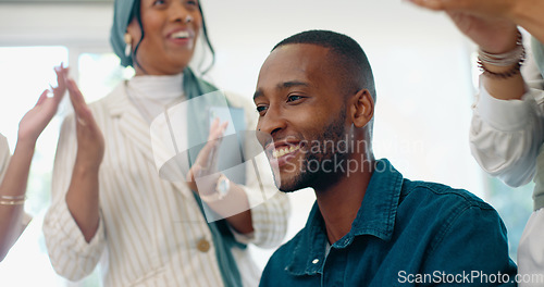 Image of Success, applause and feedback, man in office at creative startup business with proud team. Congratulations, cheering and support for winner target achievement with employees clapping hands at desk.