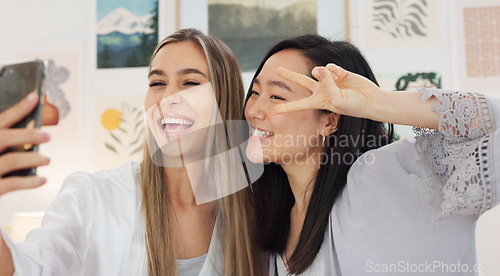 Image of Friends taking selfie with a phone on the wedding morning preparing for the day together in room. Event, smile and happy bride showing her ring while taking picture with her best friend on smartphone