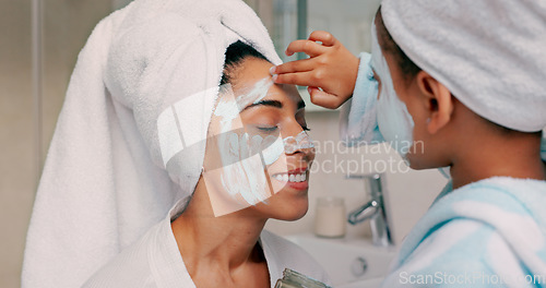 Image of Family, facial and mask with mother in bathroom with young child using hand to apply cosmetics. Wellness, black family and face cosmetic pamper treatment with kid and mama in happy home.