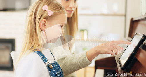 Image of Music development, girl learning piano and musical note education from mom in the home living room. A child musician playing keys, learn creative audio art and fun concert performance in family house