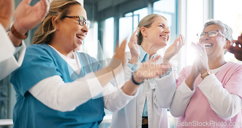 Image of Doctor, support and applause in celebration for team unity, healthcare achievement or goal at the hospital. Group of medical professional clapping and celebrating teamwork, unity or victory at clinic