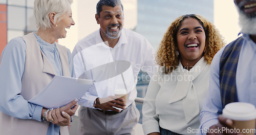 Image of Collaboration, meeting and planning with a business team outdoor together on the balcony of their office. City, teamwork and diversity with a man and woman employee group talking strategy outside