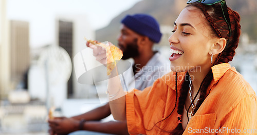 Image of Pizza, rooftop and friends eating outdoor with cityscape for urban, gen z and youth lifestyle food. Happy, relax and hungry black people or woman and man with fast food and city buildings location