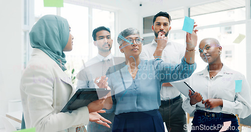 Image of Leadership, writing or business people with sticky notes for planning marketing SEO calendar, vision or mission. Teamwork, diversity or business woman in meeting for data analysis or strategy review