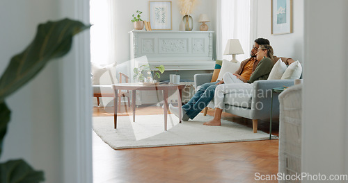 Image of Movie, coffee and couple watching tv or streaming an online series via a subscription for fun entertainment at home. Relaxing, smile and happy woman enjoying a film together on a sofa with partner