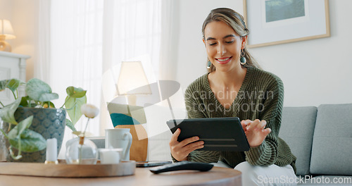 Image of Woman, digital tablet and living room app, typing and reading ebook, online shopping and 5g multimedia technology on sofa home lounge. Relax girl on social media, internet website and wifi connection