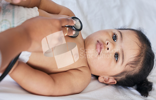 Image of Healthcare, heartbeat and baby with a doctor for a checkup, medical attention and consulting. Hospital, patient and above of a child with a pediatrician for an exam, test and examination at a clinic