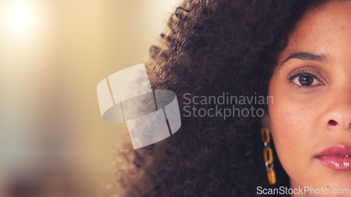 Image of Copy space of brown eye on child psychologist looking forward with an intense and serious stare while thinking of past trauma remedy. Closeup face and portrait of worried afro healthcare professional