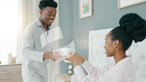 Image of African couple drink coffee in bed, relax with tea in bedroom and happy in the morning in house. Man and woman with drinks for breakfast in home, energy after sleeping and conversation in apartment