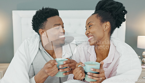 Image of Happy, couple and coffee in bed of black people relax and calm with happiness in a house bedroom. Smile, love and calm home experience of a man and woman together with a blanket drinking tea