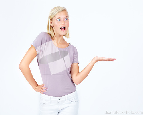 Image of Woman, wow or showing hand at marketing space, advertising mock up or product placement mockup. Model, hand gesture and surprised promotion for sales deal, winner goals or target on studio background