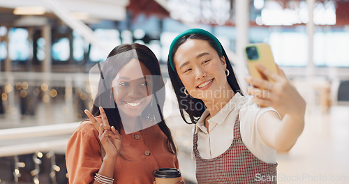 Image of Phone selfie, women and friends with peace sign at mall taking pictures for social media. Bokeh, hand gesture and girls taking photo on mobile smartphone for profile picture or happy memory together.