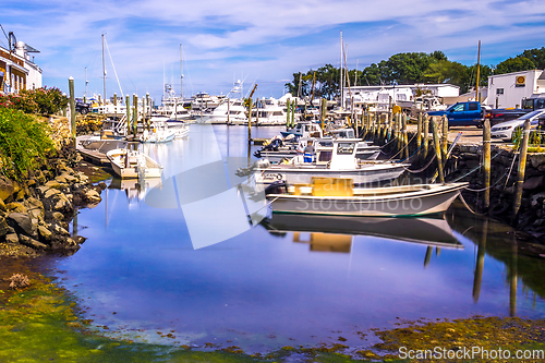 Image of Small boats lining waterfront in Wickford Cove