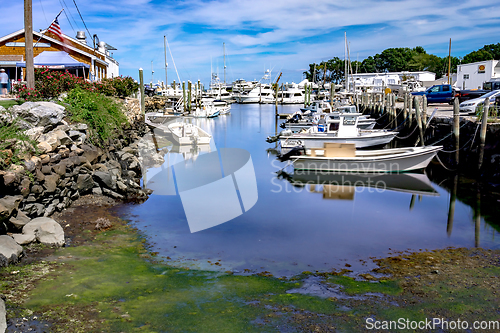 Image of Small boats lining waterfront in Wickford Cove