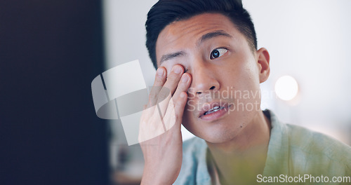 Image of Asian businessman, tired and hand on face in communication office, headache and marketing company. Man, computer or late night reading with burnout, target or kpi at digital marketing agency in Tokyo