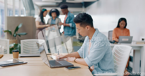 Image of Writing, research and laptop with businessman in office with notebook for thinking, idea or planning. Marketing, administration and strategy with asian employee in startup for review, blog or website