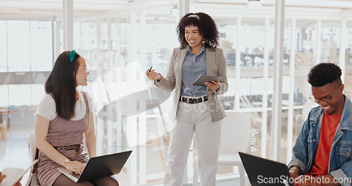 Image of Business woman, mentor or tablet in team meeting in digital marketing office, advertising company or branding startup. Smile, happy or talking manager in workshop training or technology collaboration