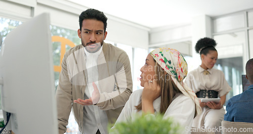 Image of Business people, mentor and coaching employee on computer for training, learning or idea by office desk. Businessman, coach or manager talking to colleague in planning, ideas or meeting at workplace