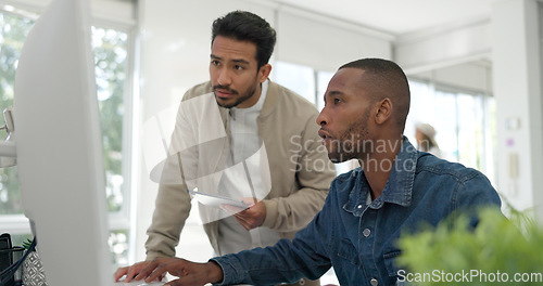 Image of Businessman, startup and coaching conversation at desk with tablet, computer and question for mentor in office. Black man, web design coach and learning in workplace for support, advice or teamwork