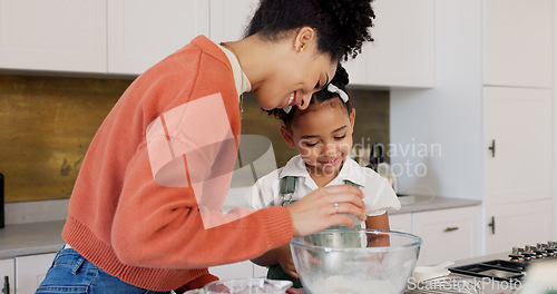 Image of Family, children and baking with a woman and girl cooking in the kitchen of their home together. Food, taste and love with a mother and daughter adding ingredients to a bowl while preparing a dessert