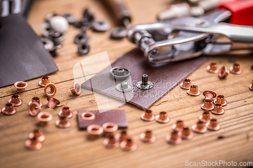 Image of Eyelet punch and rivets