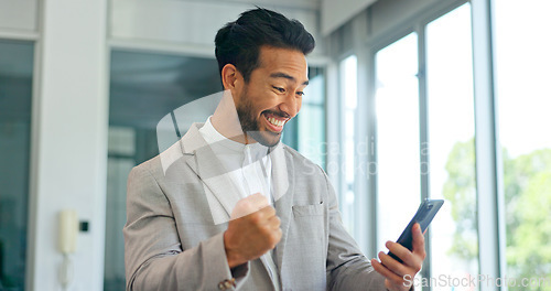 Image of Success, phone and winner with businessman in office and celebration for deal, growth and stock market target. Wow, goals and good news with fist of employee for achievement, future and sale