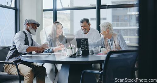 Image of Business people, laptop or documents in diversity meeting for company financial planning, investment strategy or insurance ideas. Smile, happy or talking finance workers with fintech technology paper