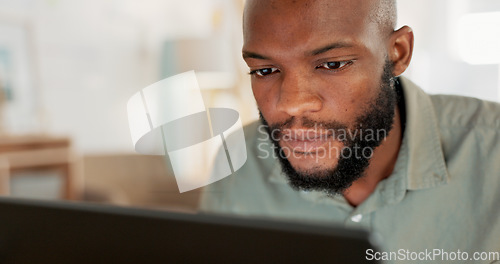 Image of Laptop, work and businessman reading an email, working on the internet and doing a search for ideas at work. African worker, employee or man in corporate on the web with technology for a project