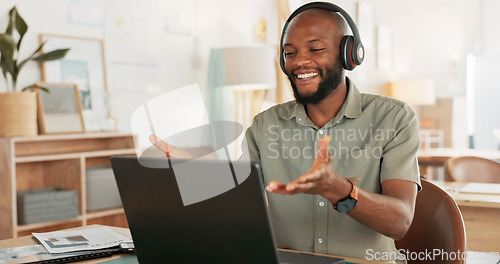 Image of Laptop, headphones and black man on an online video call or meeting for his remote corporate job. Happy, talking and African guy on a webinar, video conference or seminar call with a computer at home