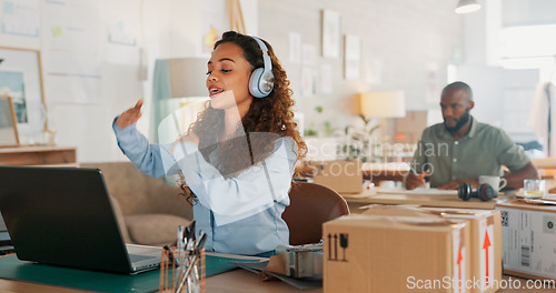 Image of Video call, customer service woman in a courier office for product consulting, sales negotiation or ecommerce. Logistics, customer support or business consultant laptop, headphones and shipping boxes