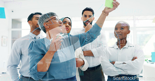 Image of Leadership, writing or business people with sticky notes for planning marketing SEO calendar, vision or mission. Teamwork, diversity or business woman in meeting for data analysis or strategy review