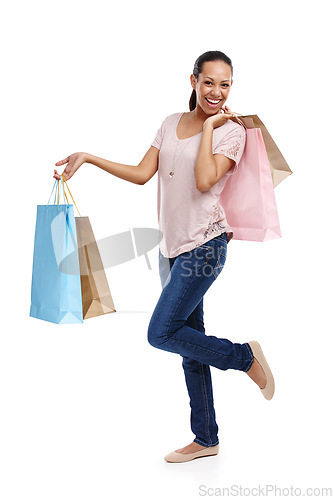 Image of Studio, fashion and portrait of woman with shopping bags isolated on a white background. Black Friday discount, sales deals and happy female customer holding gifts after buying at mall, store or shop