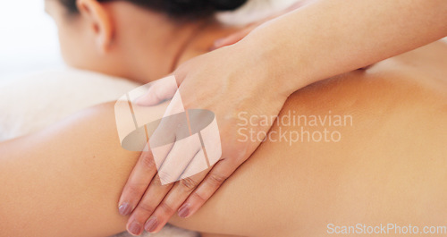 Image of Relax, hand and therapist massage customer at luxury health and wellness spa for skincare and body treatment. Woman, physical therapy and hands on back for calm, stress relief and muscle tension