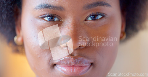 Image of Confident and proud black woman smiling, showing strength and dignity. Closeup of the face and head of a beautiful young african american female showing her teeth with a big smile and feeling happy